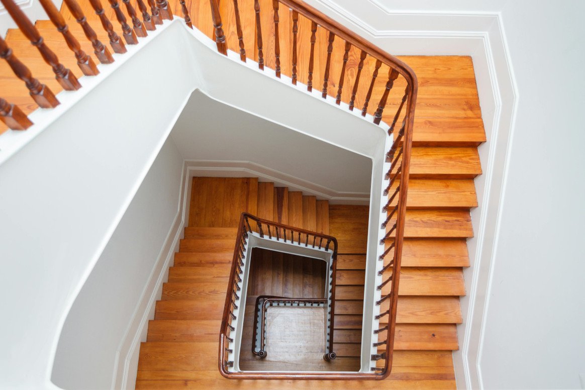 Custom Wooden Staircase with Polished Handrail Finish
