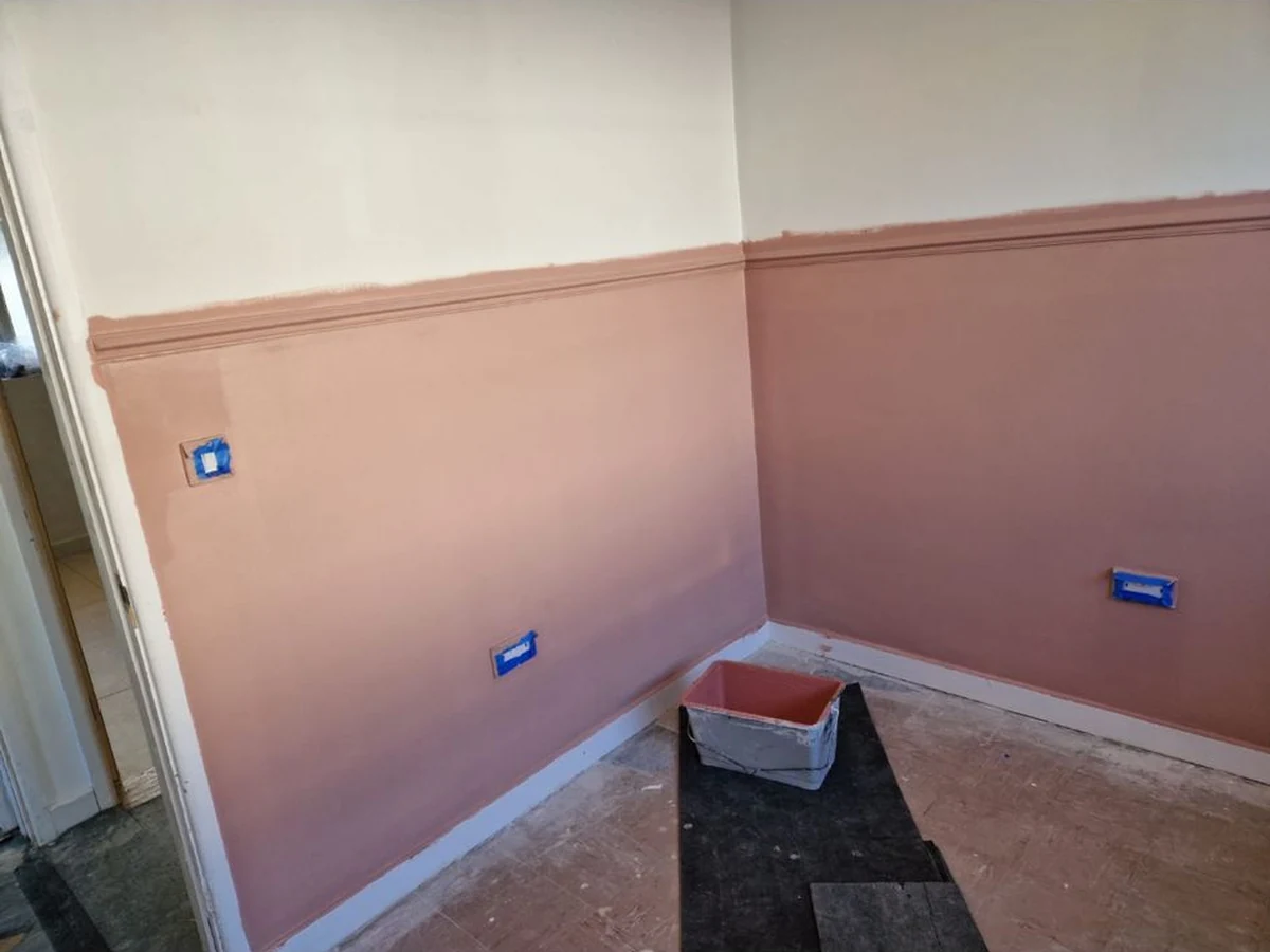 Mid-renovation room interior in Swansea by Daffodil Carpentry, dado rail fitting with exposed socket boxes