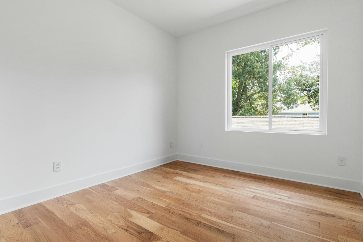 Wood Flooring 13 Straight-laid wood boards in a bright empty room