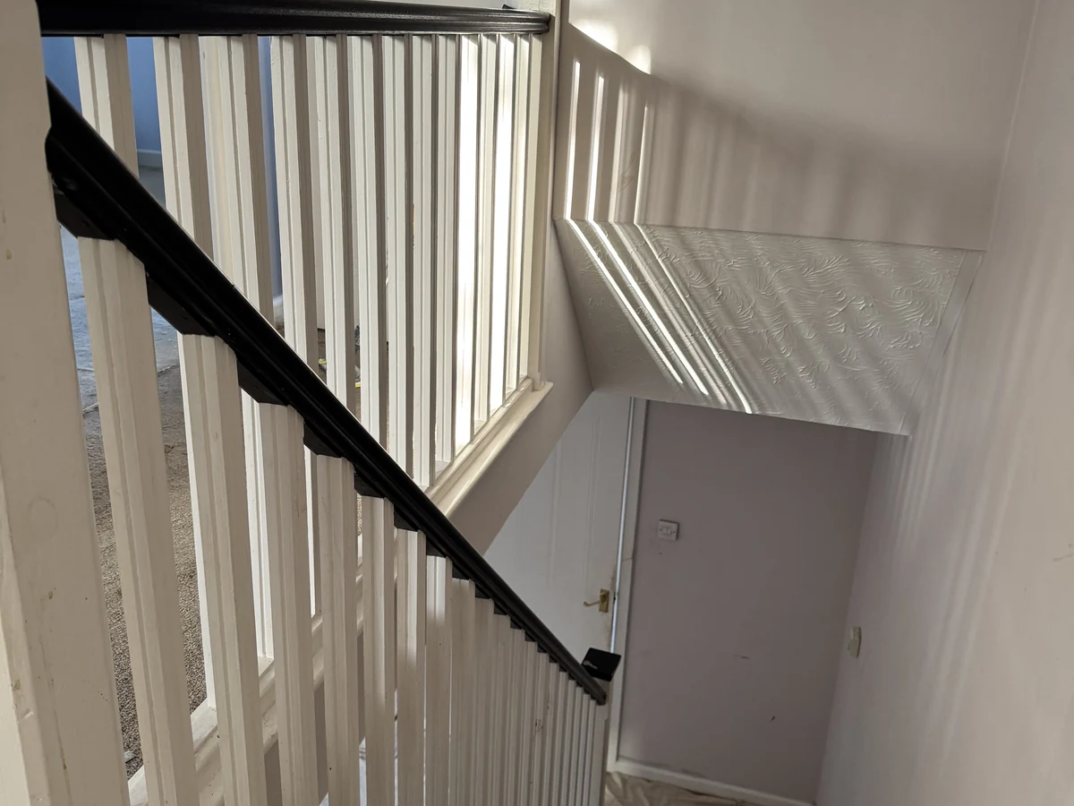 staircase white spindles black handrail downward angle swansea daffodil carpentry