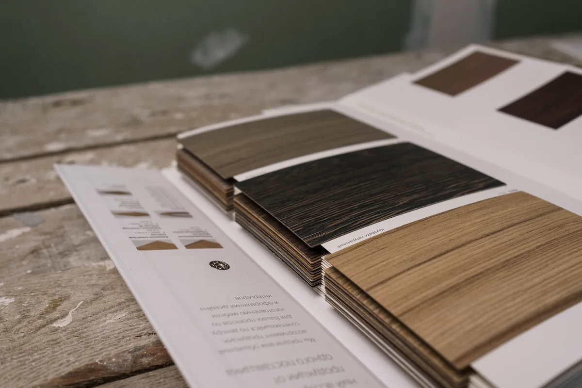 Wood-finish sample book showing light and dark grain patterns Wood-finish sample book showing light and dark grain patterns